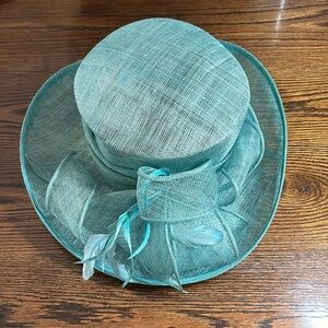 Teal event hat with feather detail